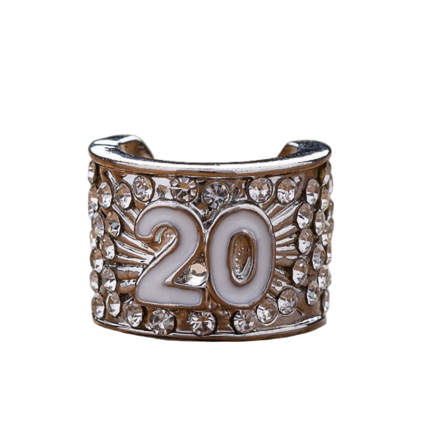 A silver-colored custom stethoscope charm with the number 20 displayed prominently in the center, placed on a wooden surface.