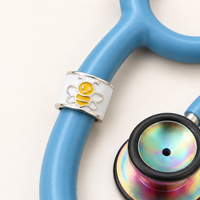 Bee Charm Stethoscope Charm close-up on blue stethoscope