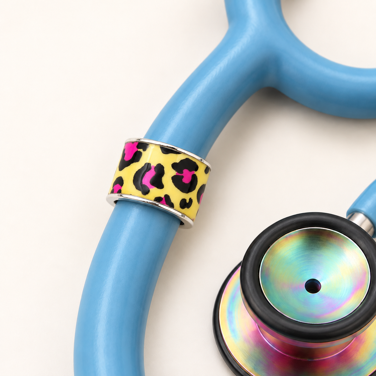 Cheetah Stethoscope Charm close-up on blue stethoscope
