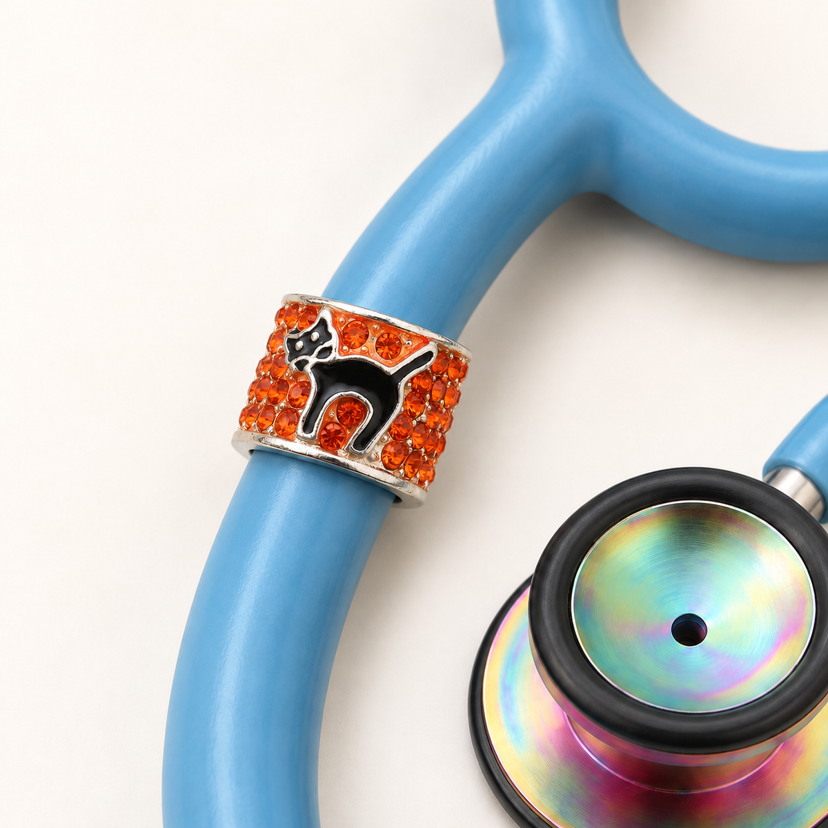 Halloween Cat Stethoscope Charm close-up on blue stethoscope