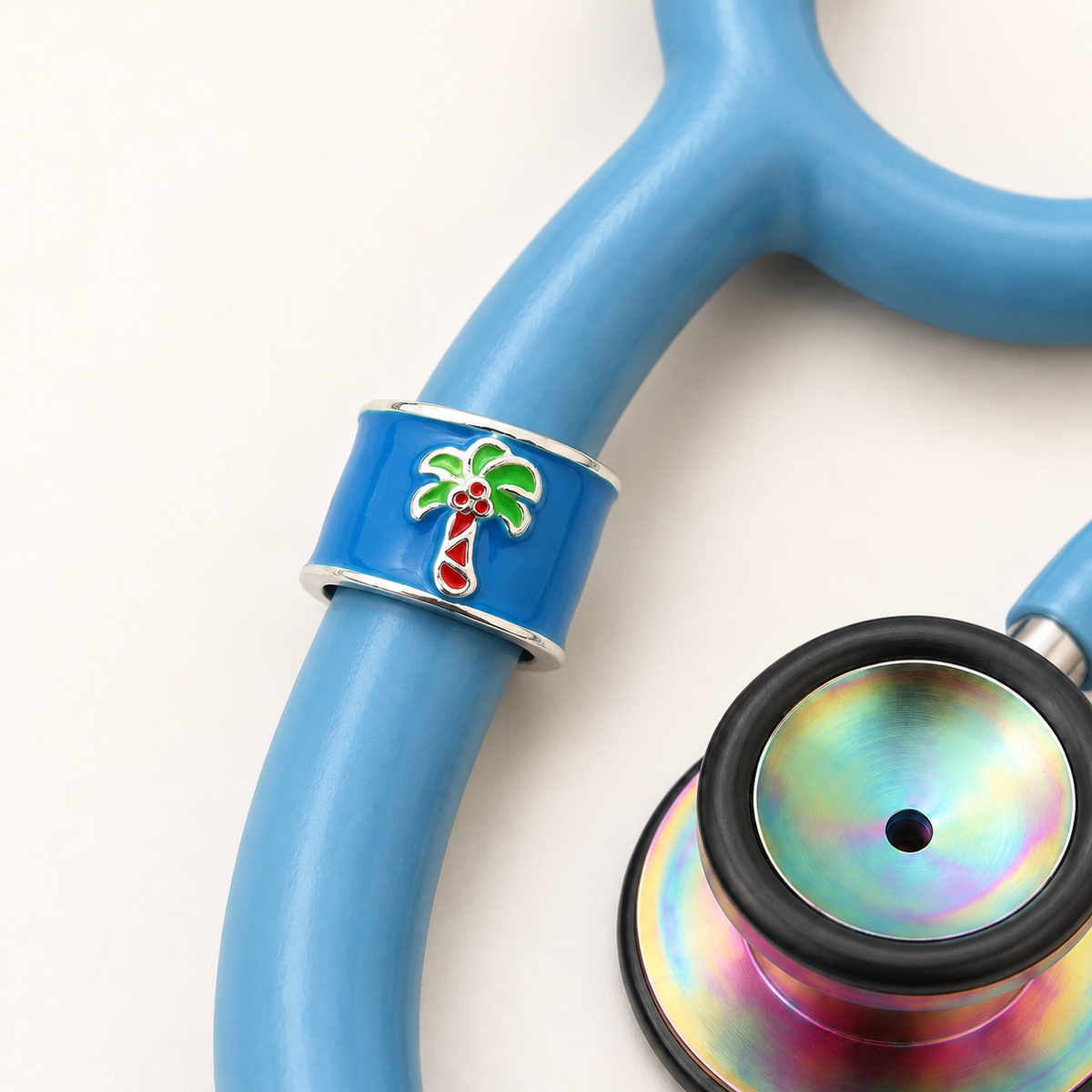 Palm Tree Stethoscope Charm close-up on blue stethoscope