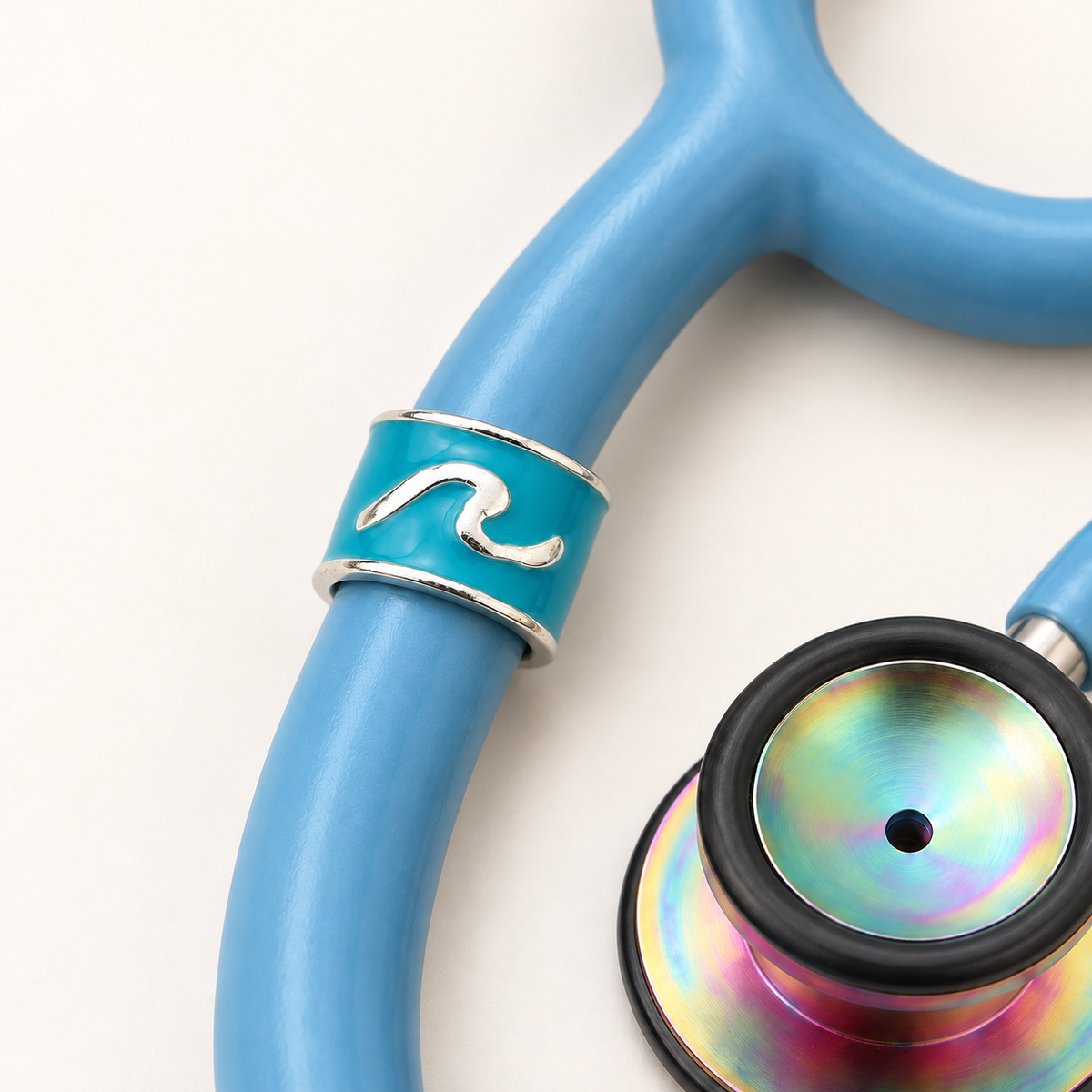 Wave Stethoscope Charm close-up on blue stethoscope