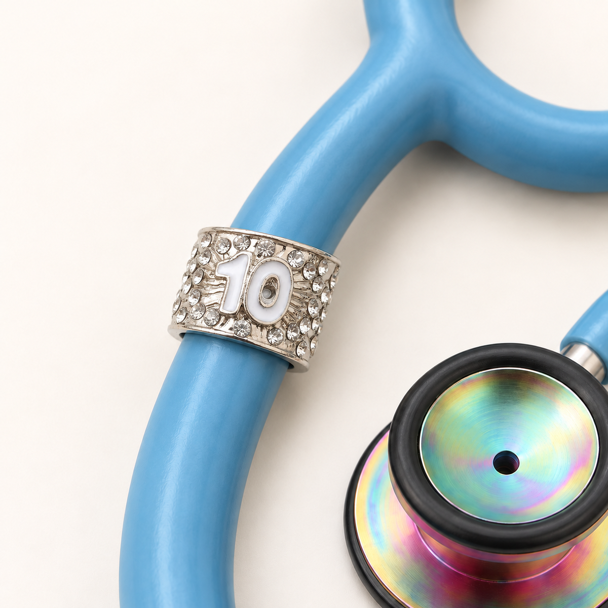 10 Years Stethoscope Charm close-up on blue stethoscope