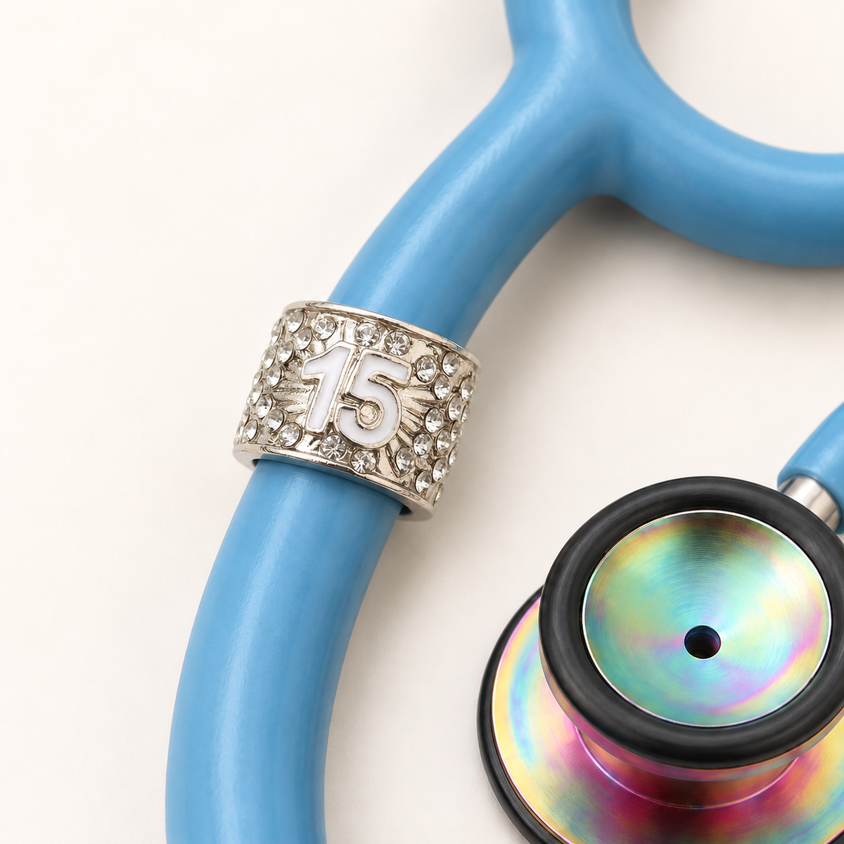 15 Years Stethoscope Charm close-up on blue stethoscope