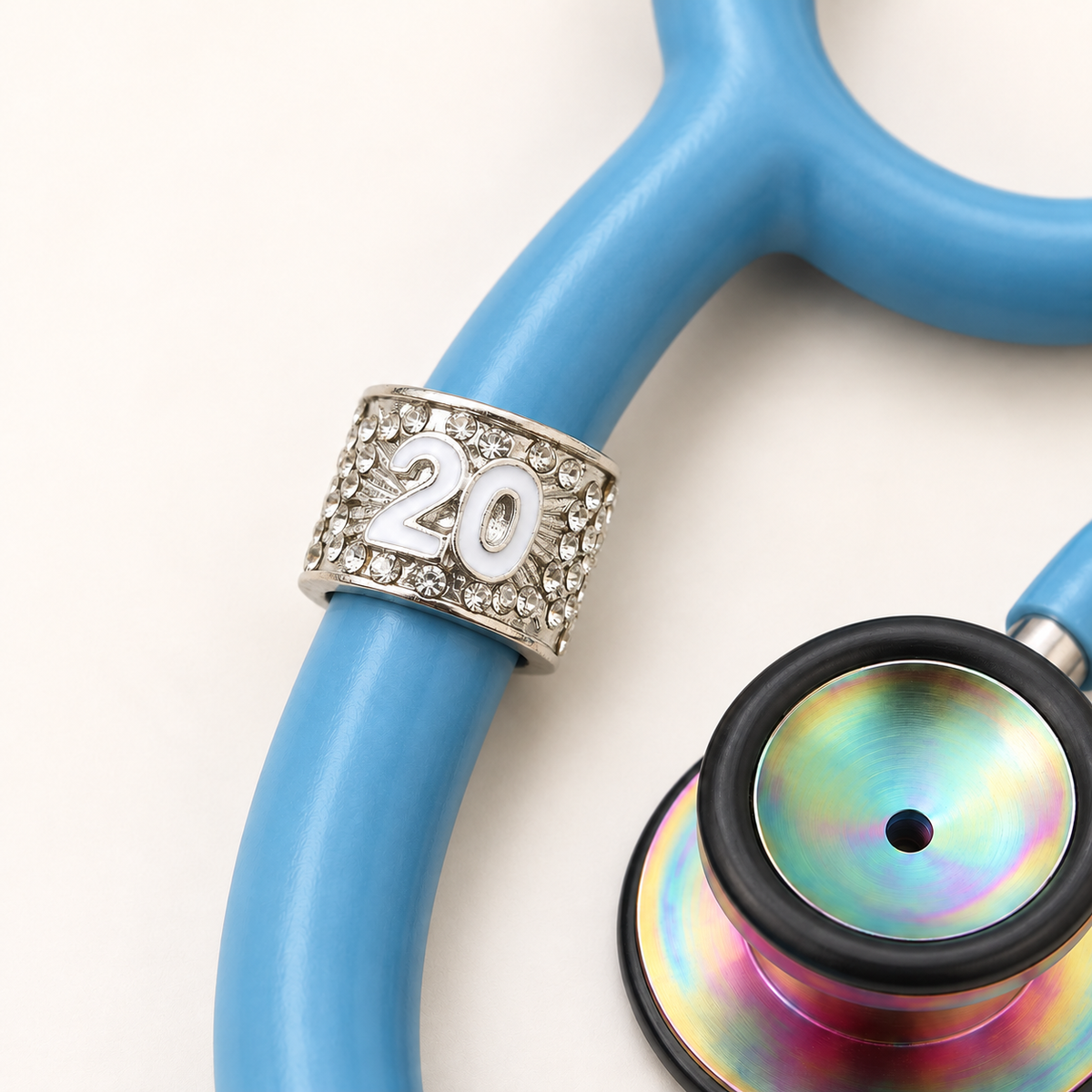 20 Years Stethoscope Charm close-up on blue stethoscope