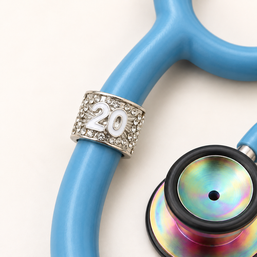 20 Years Stethoscope Charm close-up on blue stethoscope