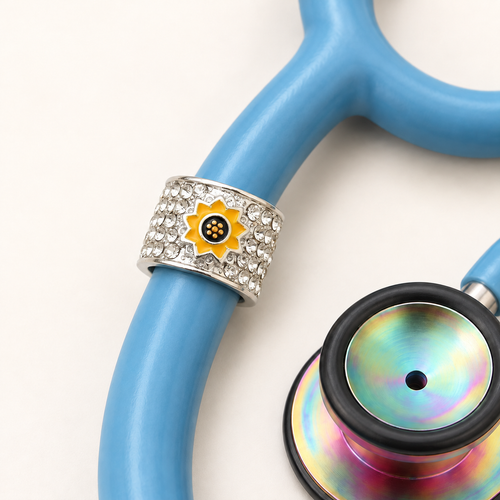 Sunflower Stethoscope Charm close-up on blue stethoscope