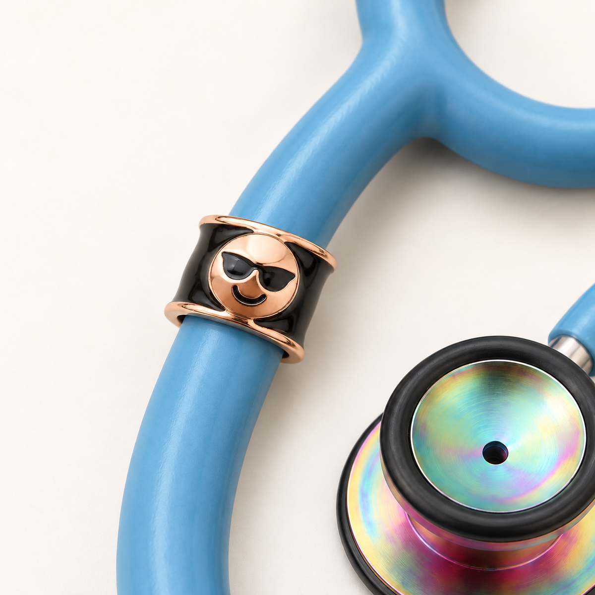 Cool Emoji Stethoscope Charm close-up on blue stethoscope
