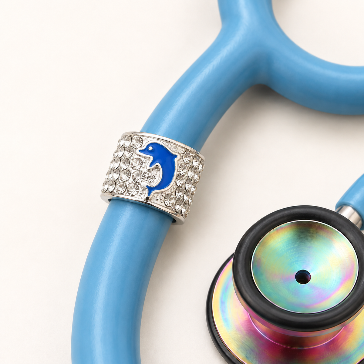 Dolphin Stethoscope Charm close-up on blue stethoscope