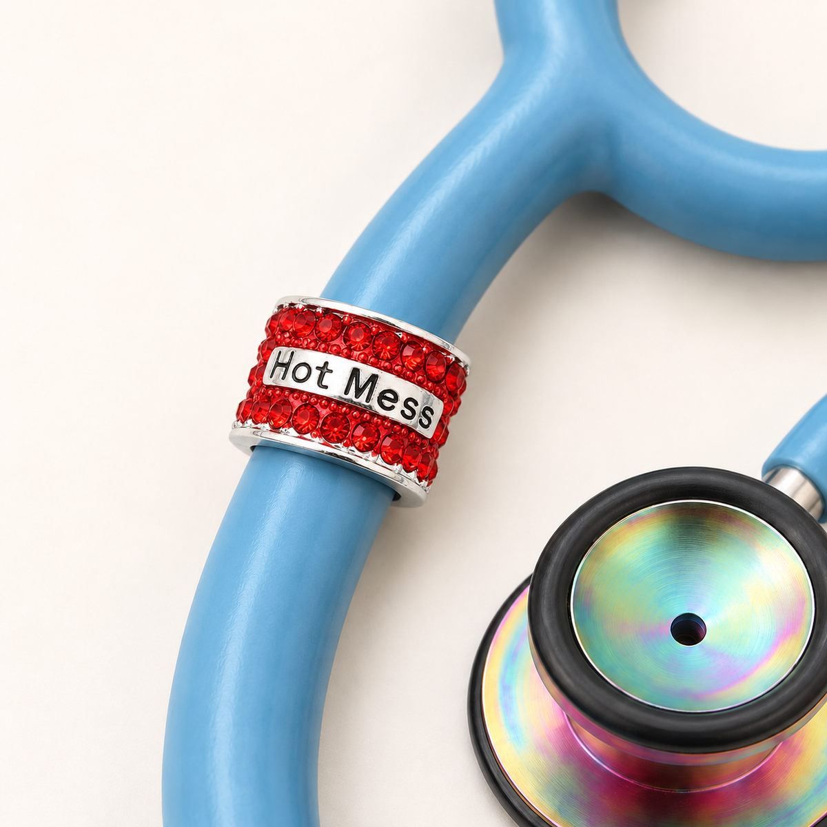 Hot Mess Stethoscope Charm close-up on blue stethoscope