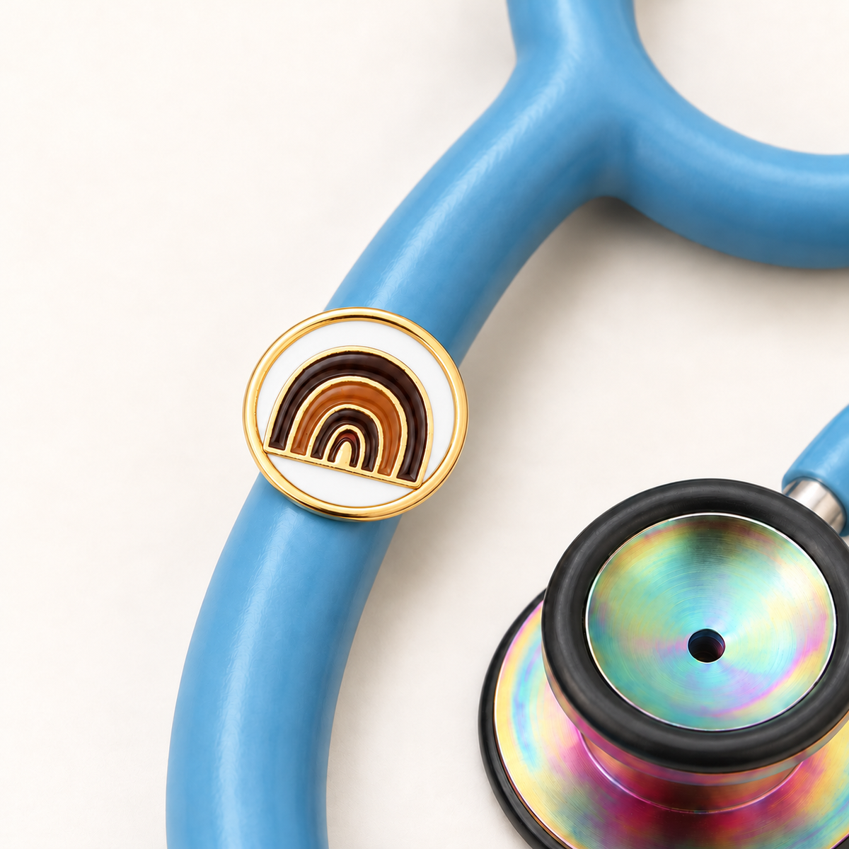 Amazing Rainbow 3D charm with white backing on blue stethoscope
