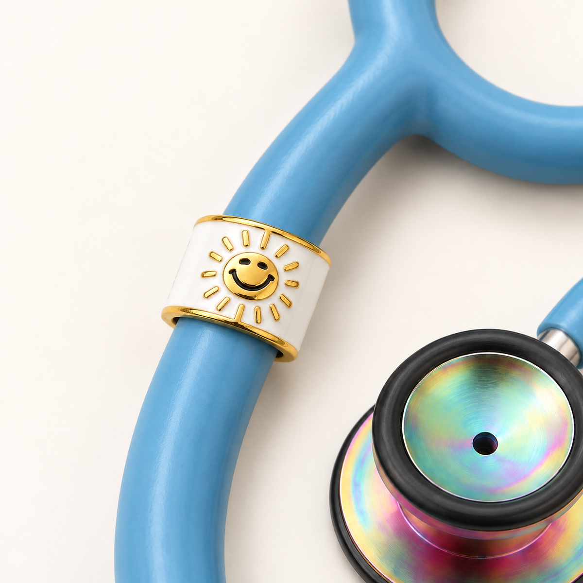 Sunshine Stethoscope Charm close-up on blue stethoscope
