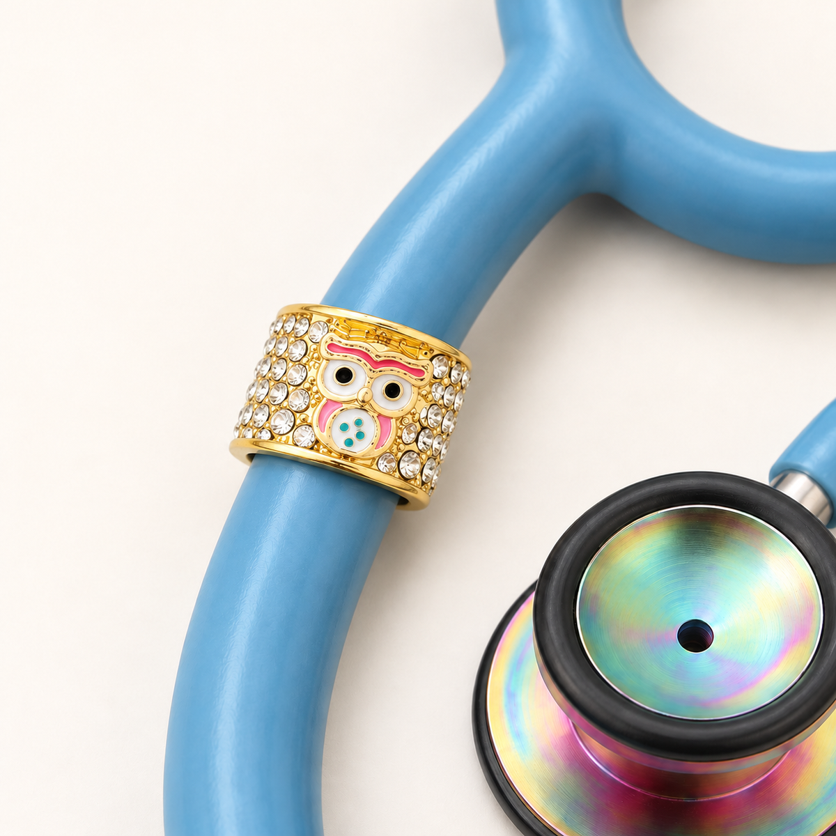 Wise Owl Stethoscope Charm close-up on blue stethoscope