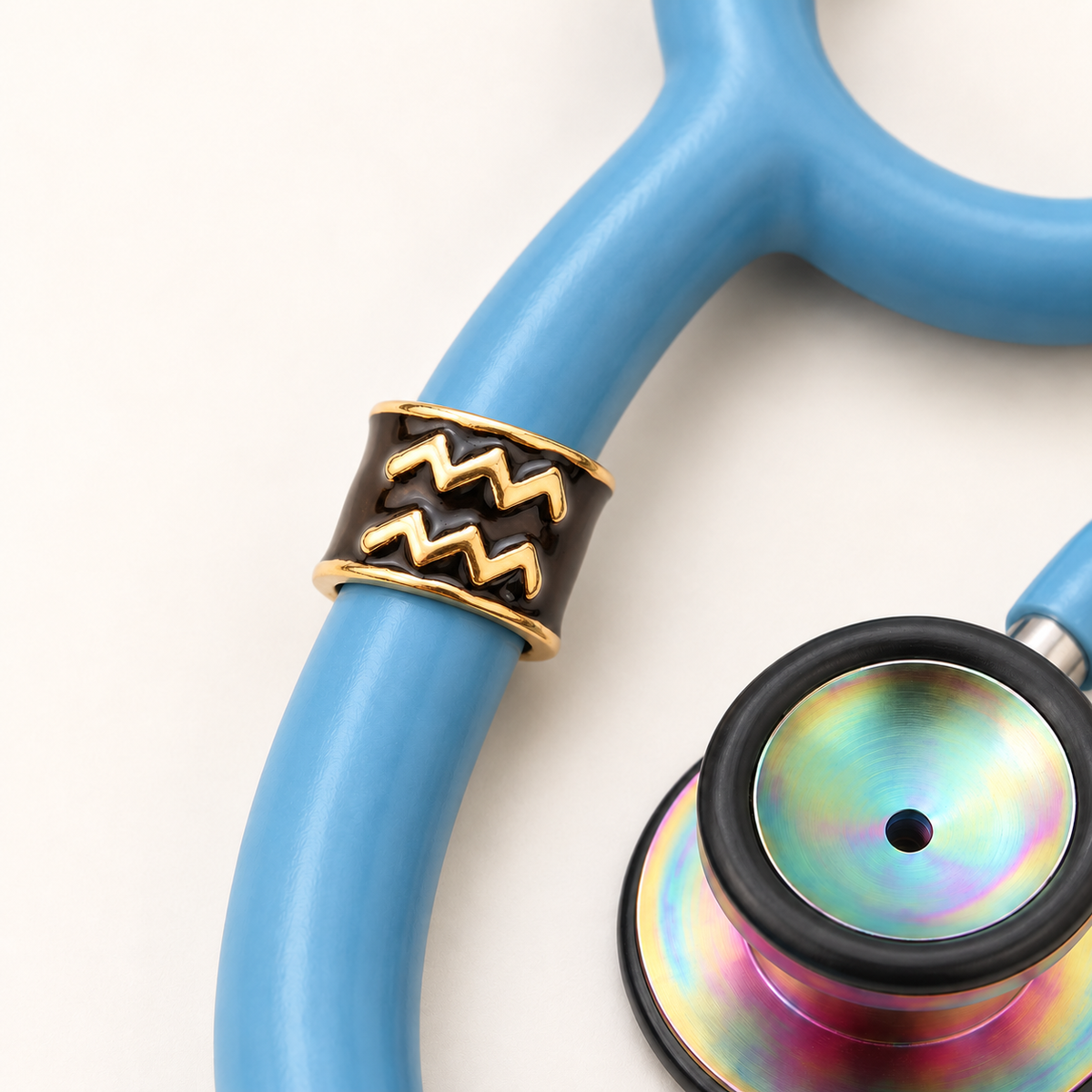 Aquarius Stethoscope Charm close-up on blue stethoscope