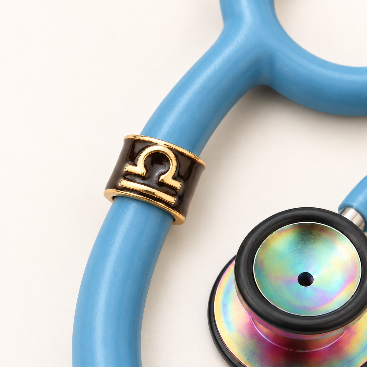 Libra Stethoscope Charm close-up on blue stethoscope