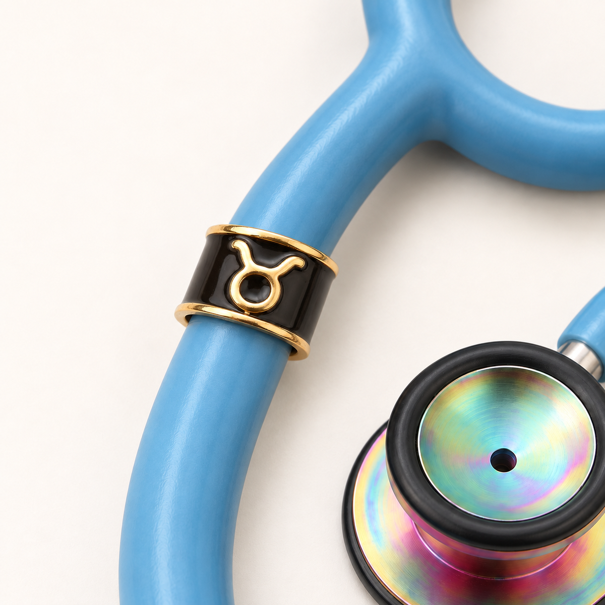 Taurus Stethoscope Charm close-up on blue stethoscope